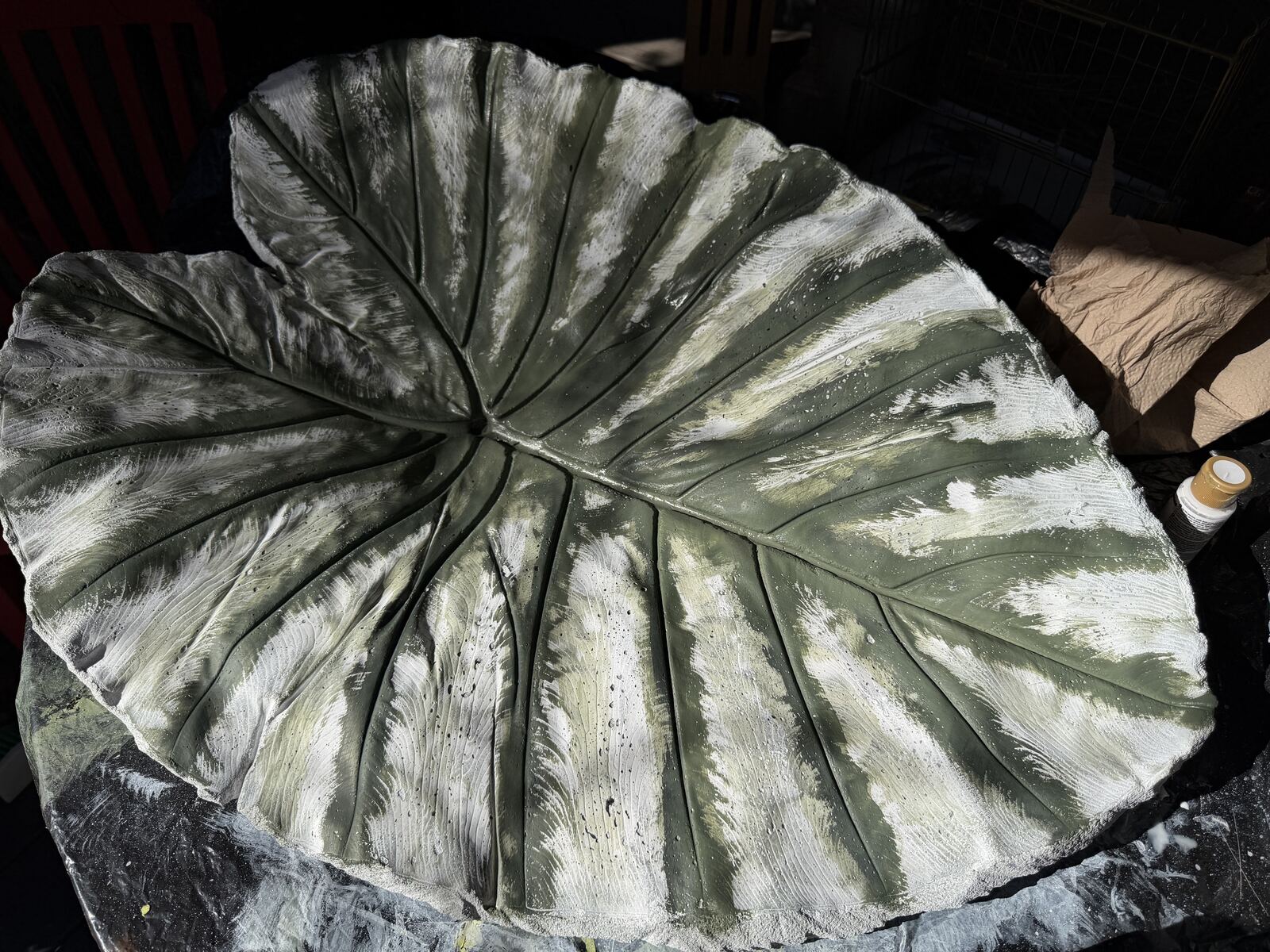 Leaf cast with a first drybrushed layer of green over white