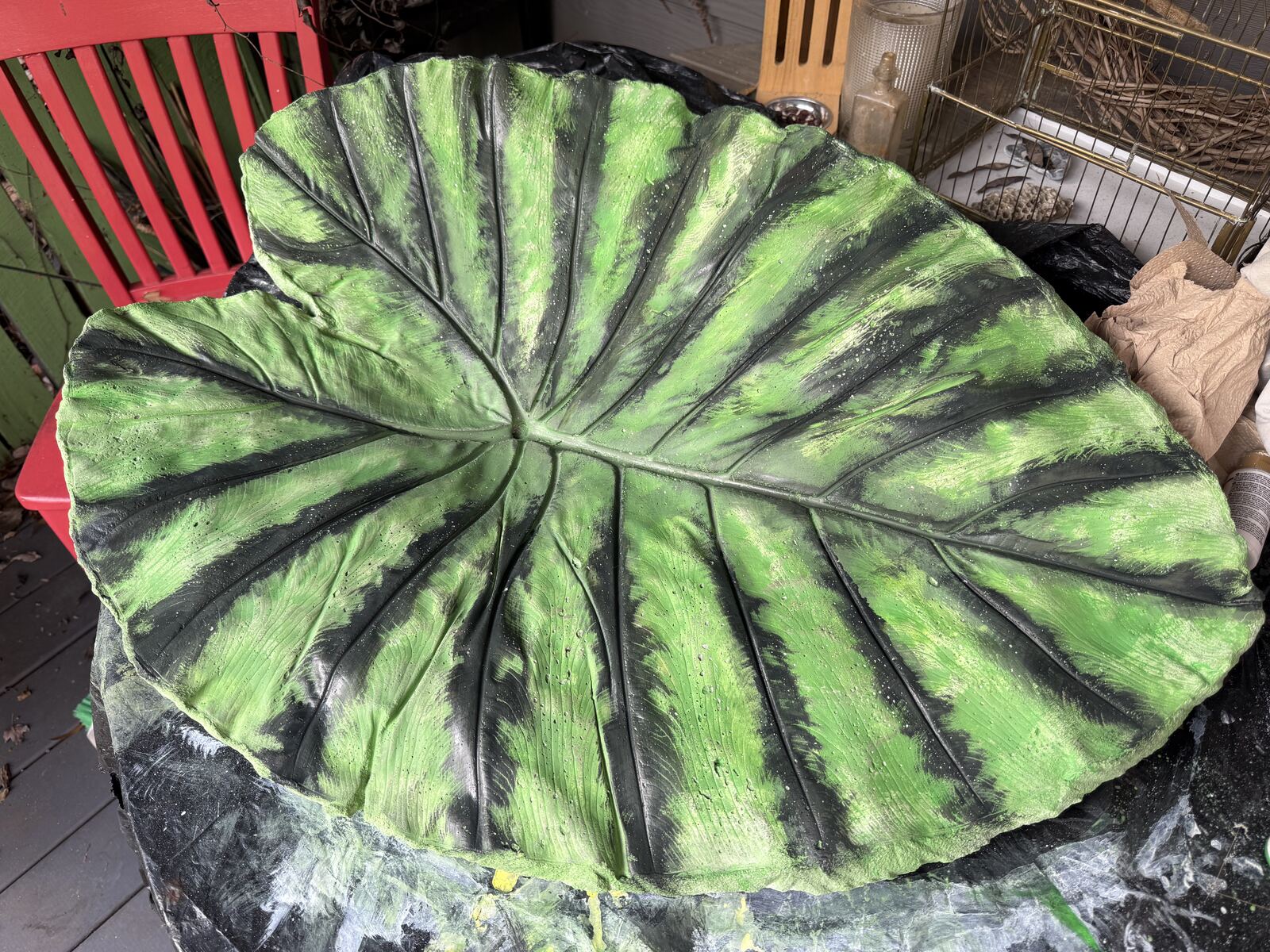 Leaf cast with deep green and dark veins